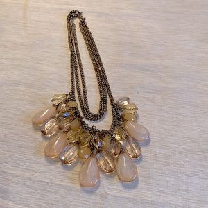 1 necklace with gold toned chain and beads that look like 3 necklaces!